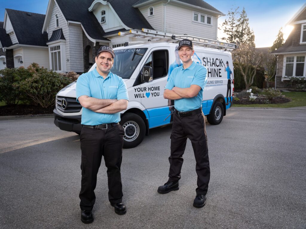 Shack Shine team in front of a home